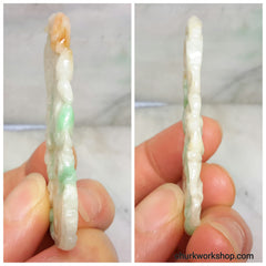 Carved jade pendant.
