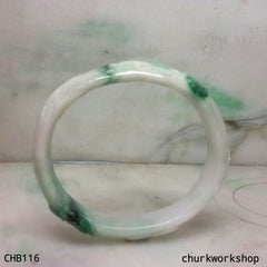 Carved green jade bangle