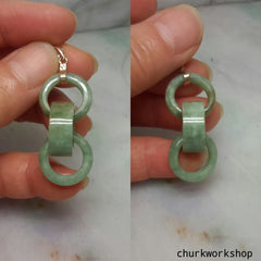 Triple ring pale green jade pendant