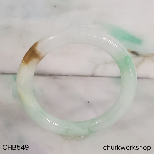 Pale green with light apple green and brown spot jade bangle