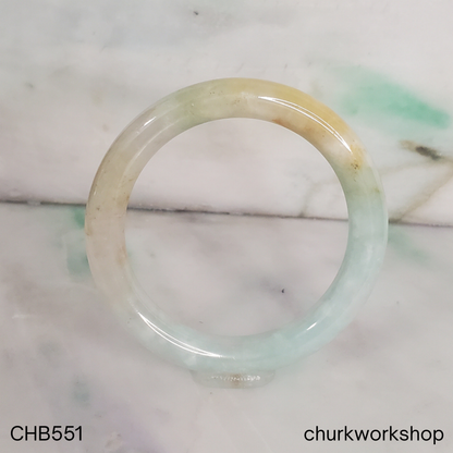 Pale apple green and light yellow brown jade bangle