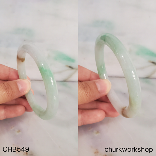 Pale green with light apple green and brown spot jade bangle