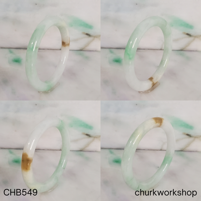 Pale green with light apple green and brown spot jade bangle