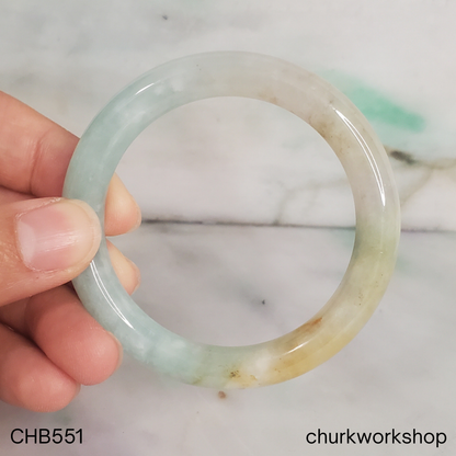 Pale apple green and light yellow brown jade bangle