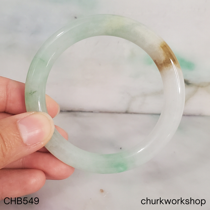 Pale green with light apple green and brown spot jade bangle