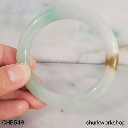 Pale green with light apple green and brown spot jade bangle