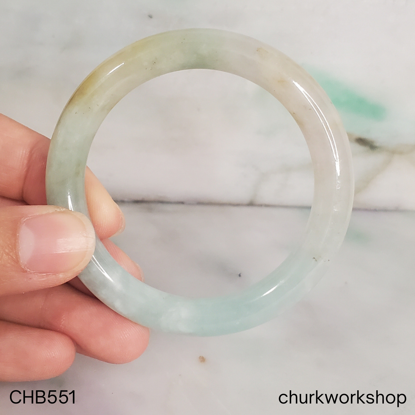 Pale apple green and light yellow brown jade bangle