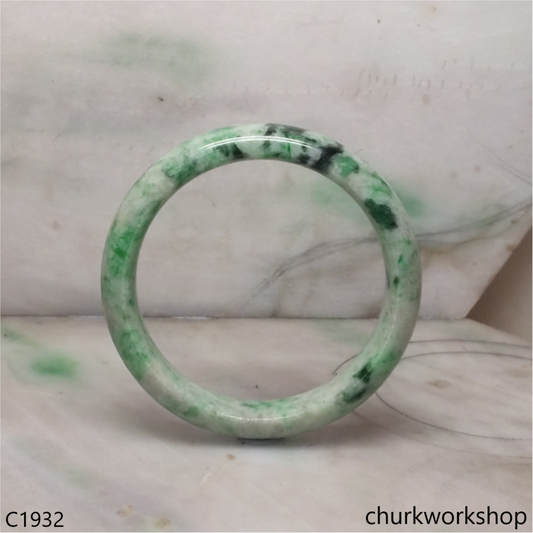 White base with green splotches  jade bangle