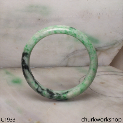 Light base with green splotches  jade bangle