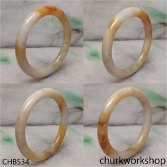 Light yellowish with splotches brown bangle