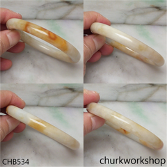 Light yellowish with splotches brown bangle