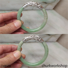 Light green jade bangle with silver wrapping