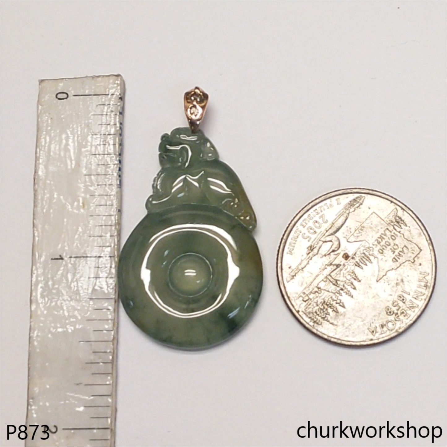 Bluish green jade pendant in 14k gold