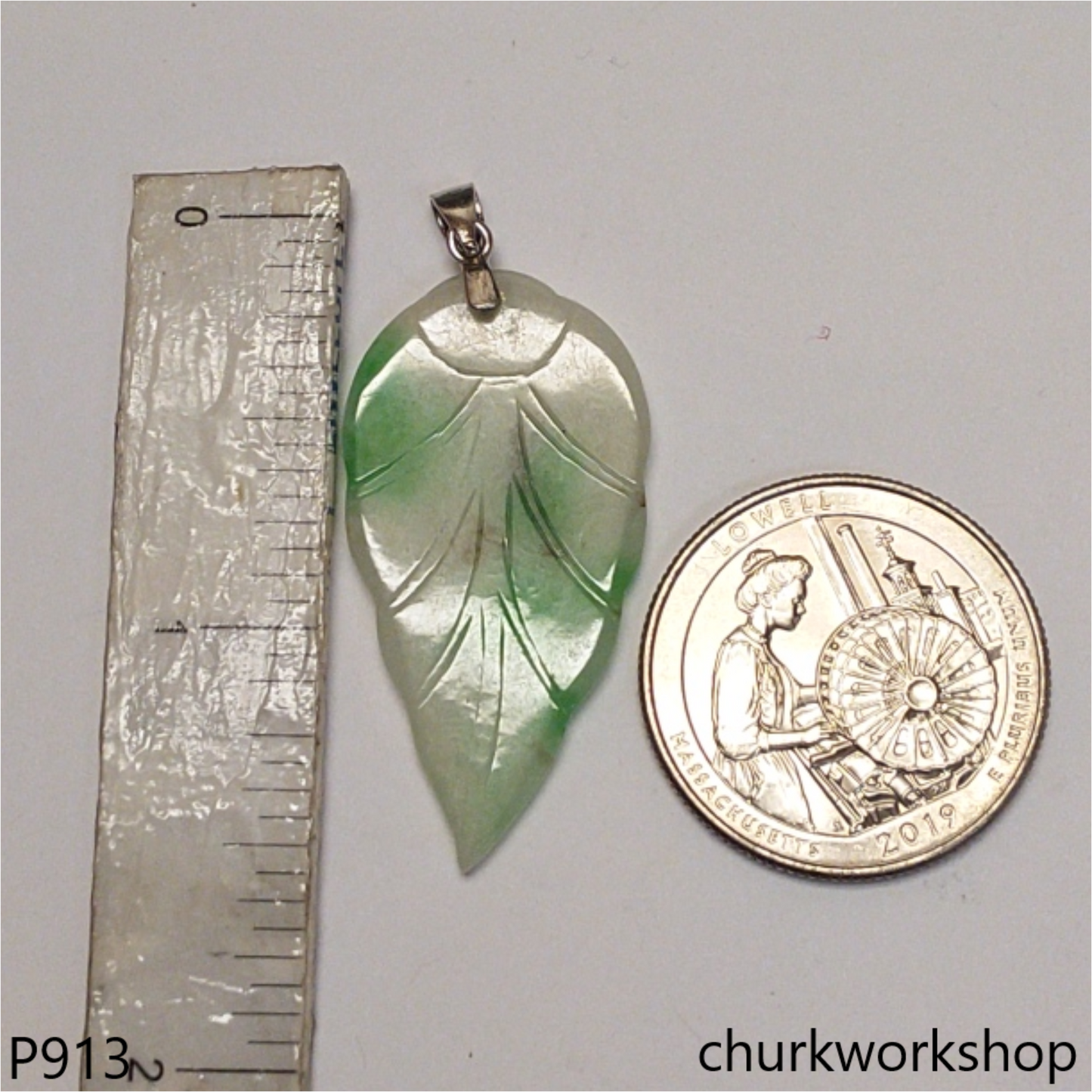 White base with green jade leaf pendant