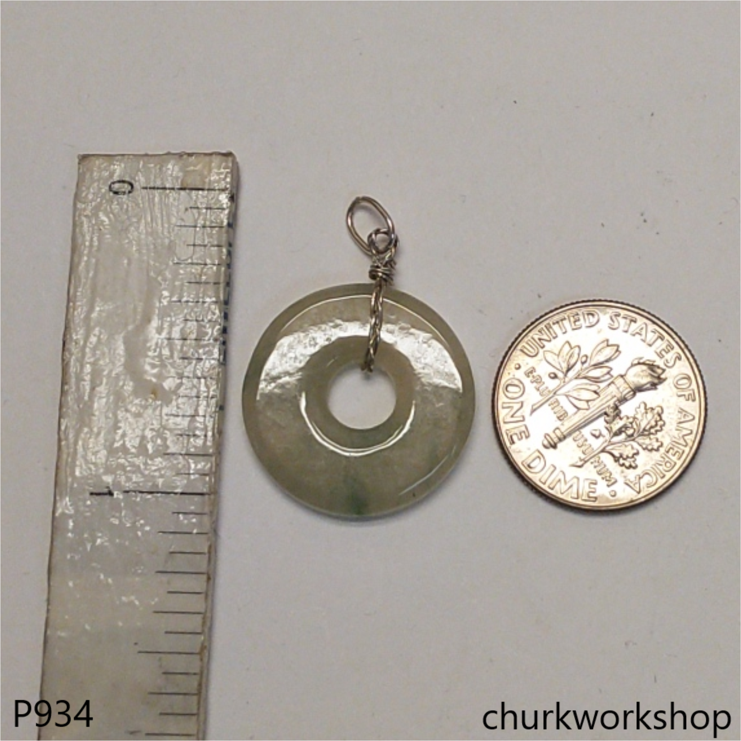 Clear with splotches bluish green jade Donut pendant