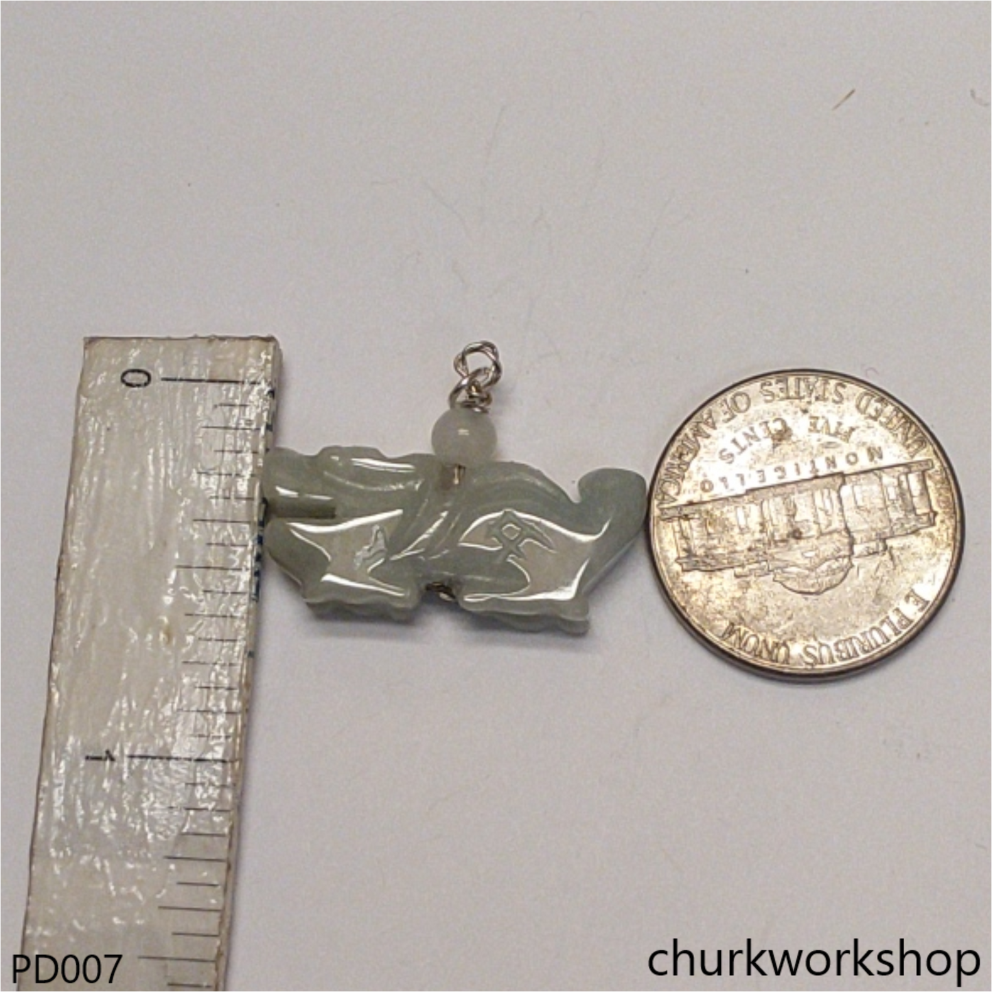 Light green jade dragon pendant