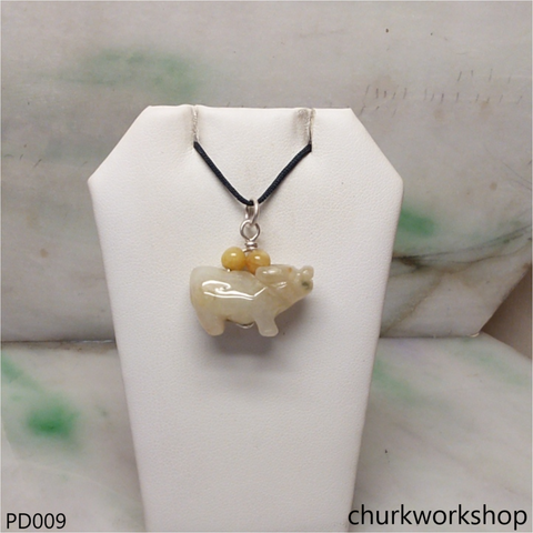 Pale yellow jade OX pendant