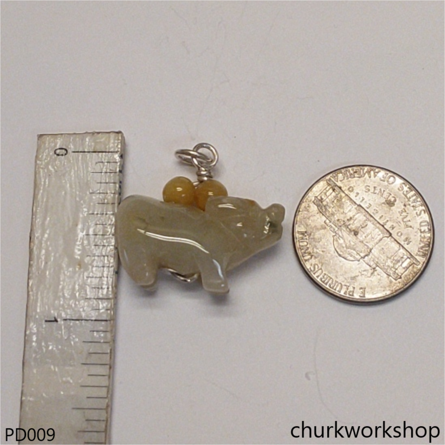 Pale yellow jade OX pendant