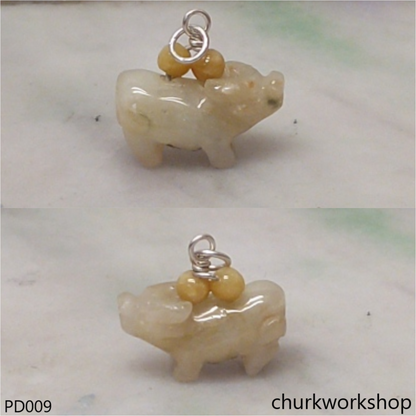Pale yellow jade OX pendant