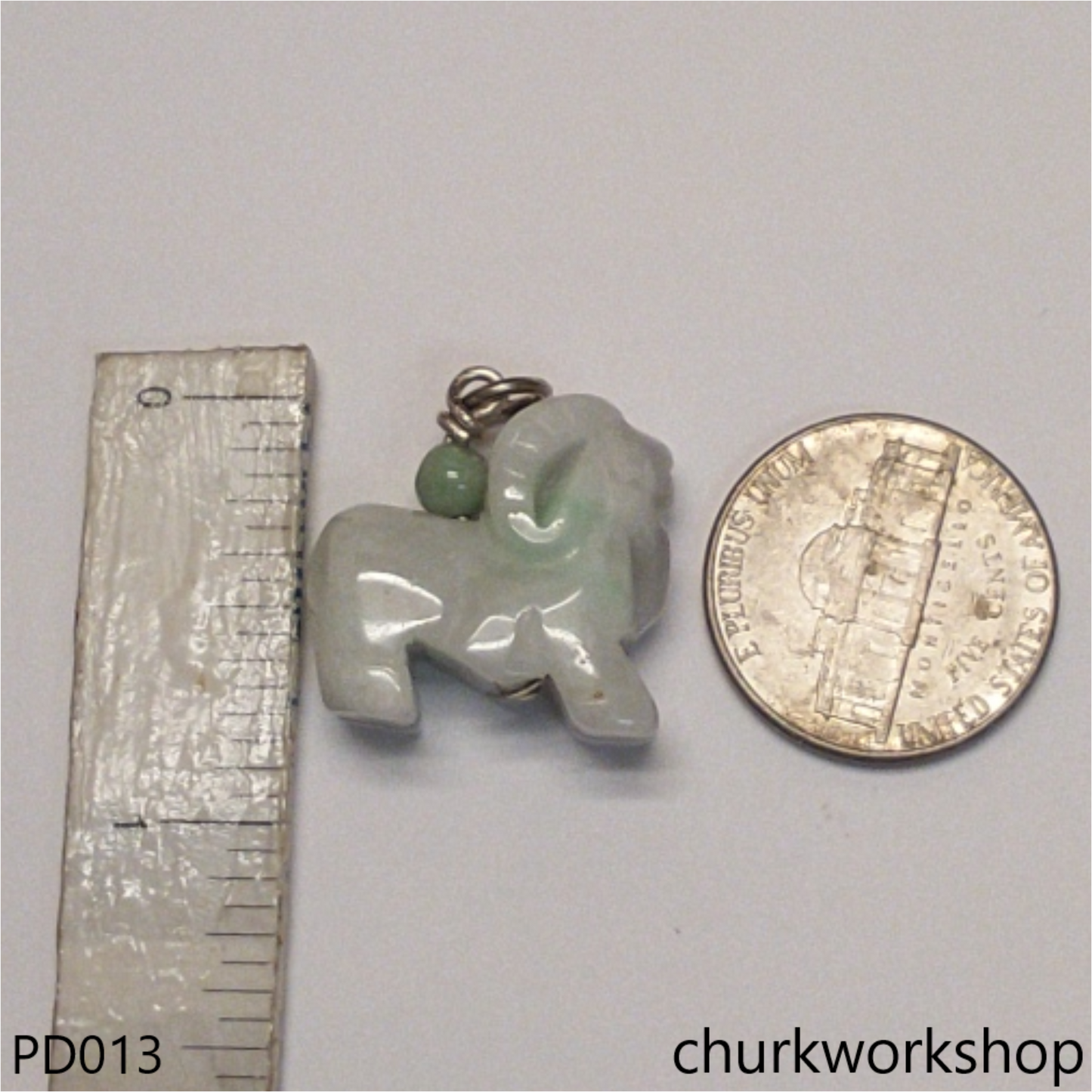 Pale green jade goat pendant