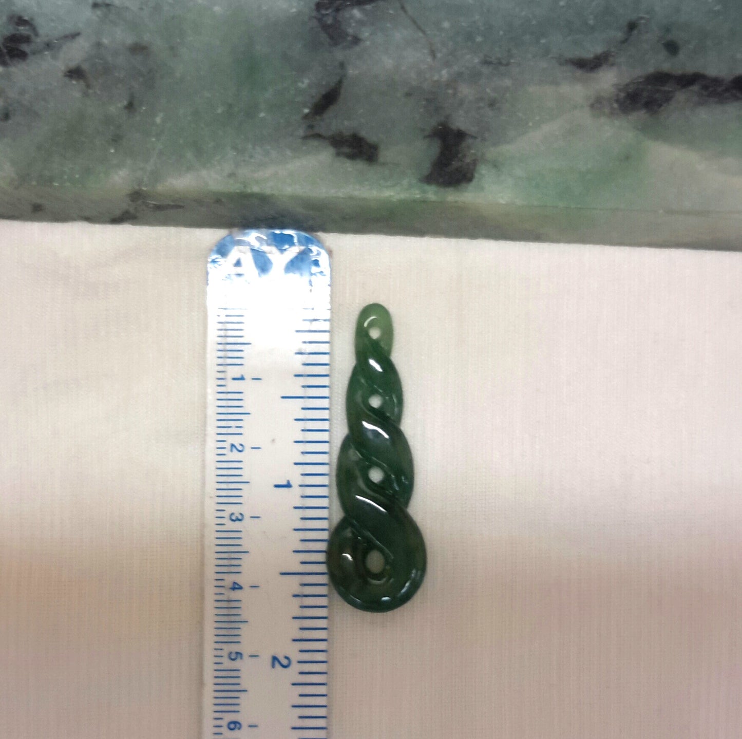 Dark green jade pendant