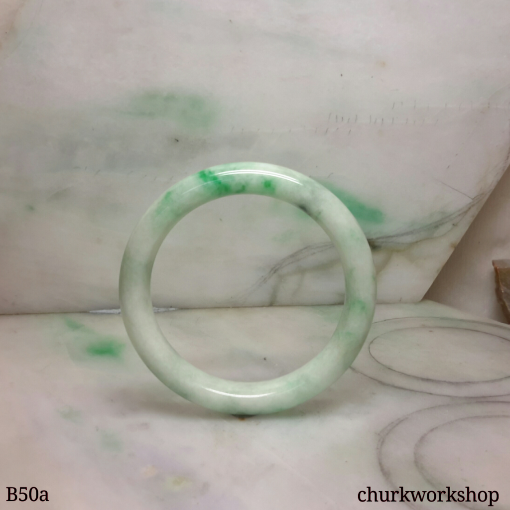 White base with green splotches jade bangle