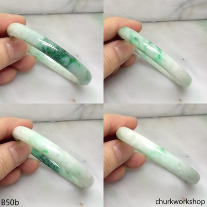Small white base with splotches green jade bangle