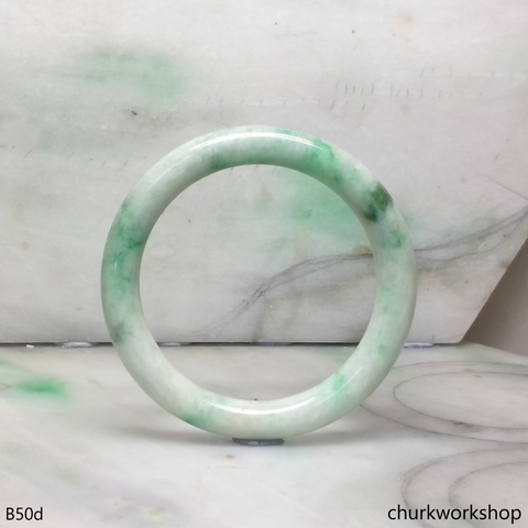 White base with green splotches jade bangle