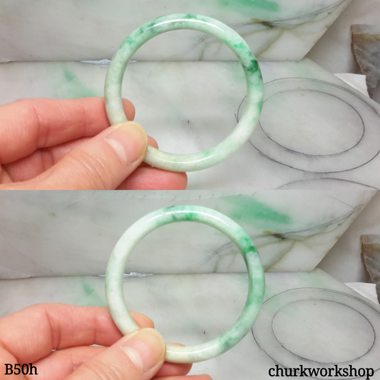 Small white base with splotches green jade bangle