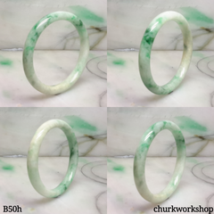 Small white base with splotches green jade bangle