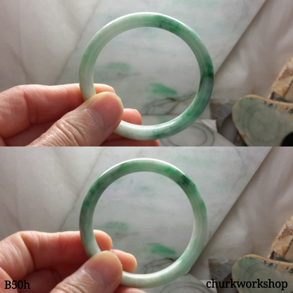 Small white base with splotches green jade bangle