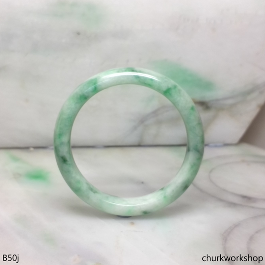 Small white base with splotches green jade bangle