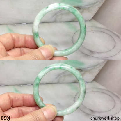 Small white base with splotches green jade bangle