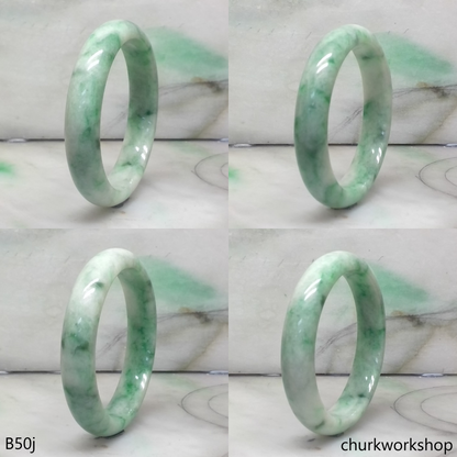 Small white base with splotches green jade bangle