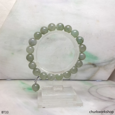 Light green beads jade bracelet with small charm