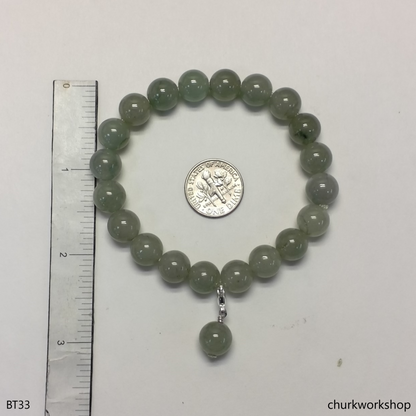 Light green beads jade bracelet with small charm