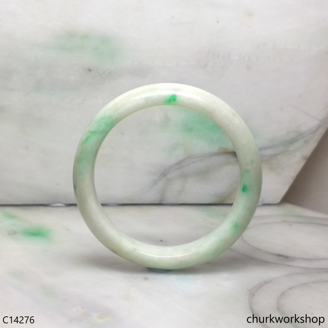 White base with splotches apple green jade bangle