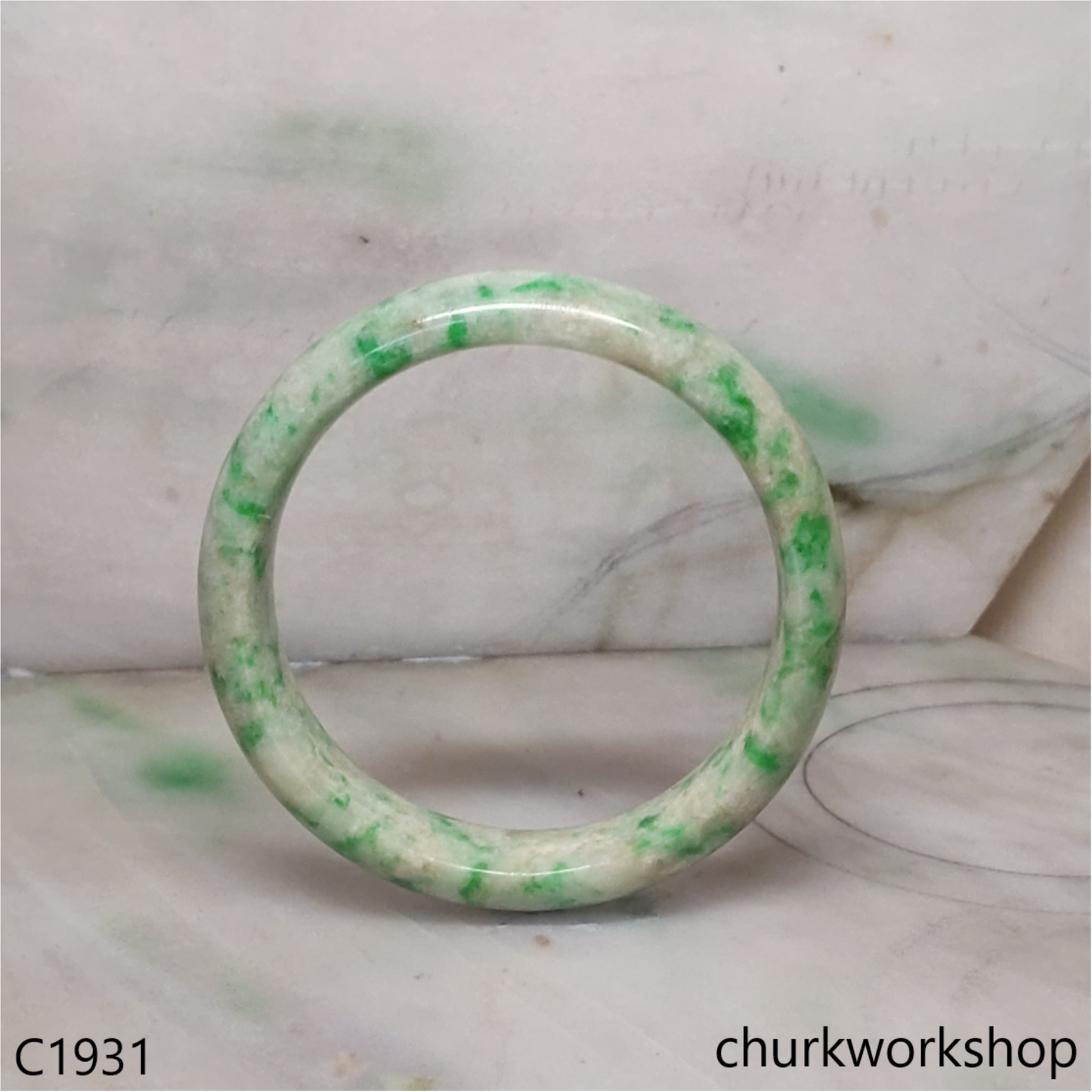 Pale yellowish base with green splotches  jade bangle