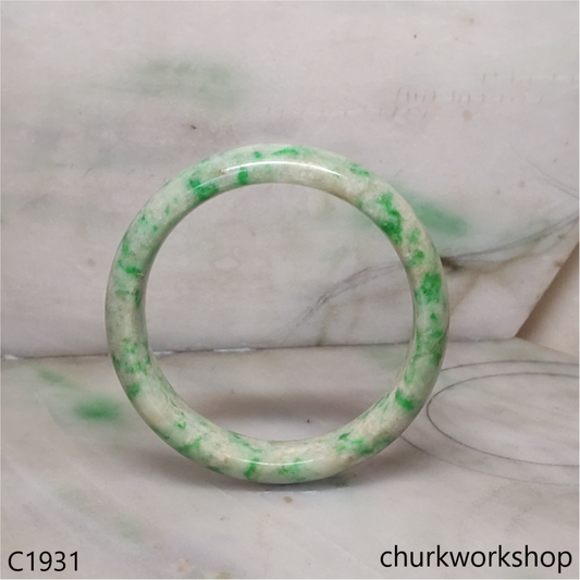 Pale yellowish base with green splotches  jade bangle
