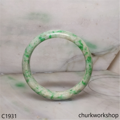 Pale yellowish base with green splotches  jade bangle