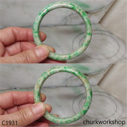 Pale yellowish base with green splotches  jade bangle
