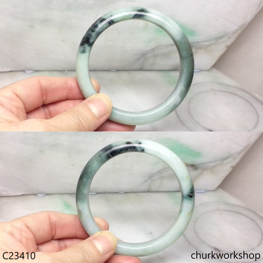 Large light green with splotches dark and bluish green jade bangle