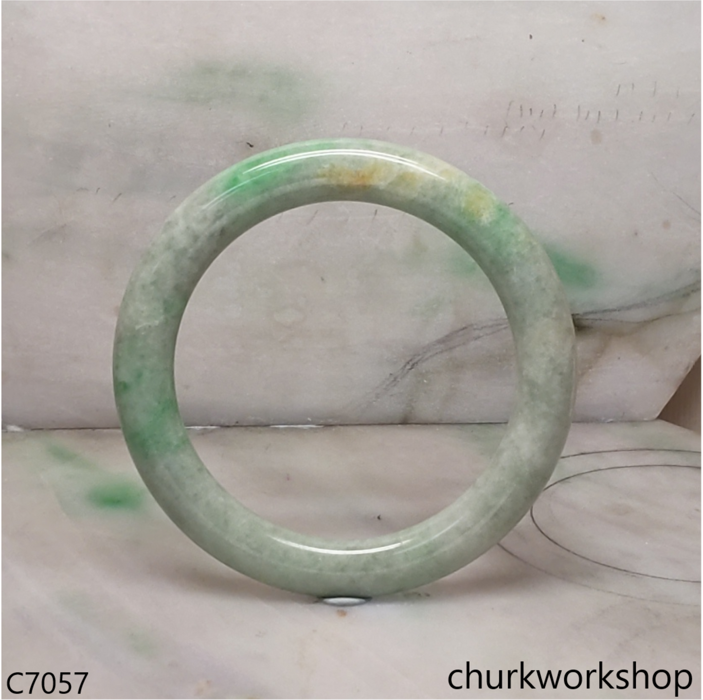 Large light green with splotches green jade bangle
