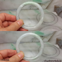 White base with splotches green jade bangle