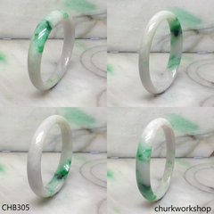 White base with splotches green & pale lavender jade bangle