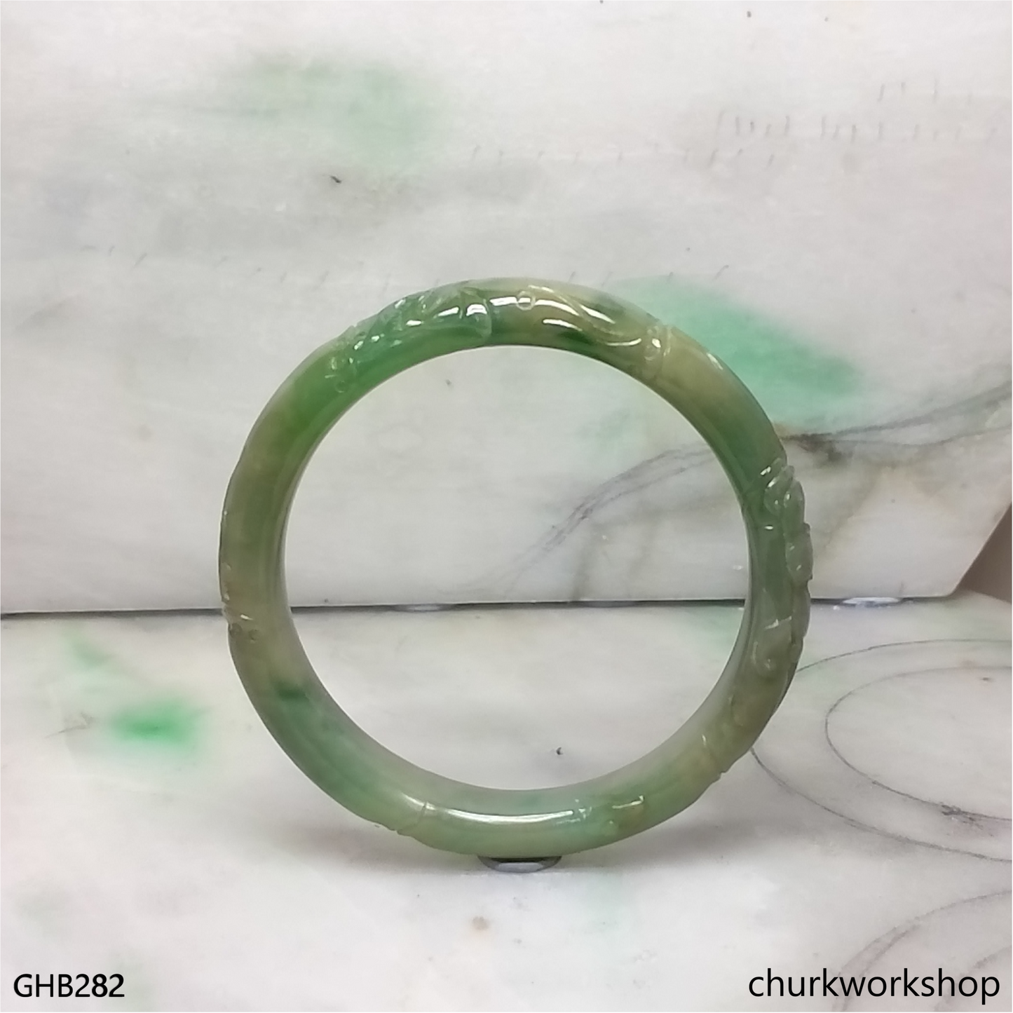 Small carved green jade bangle