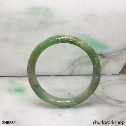 Small carved green jade bangle