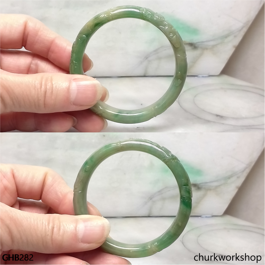Small carved green jade bangle