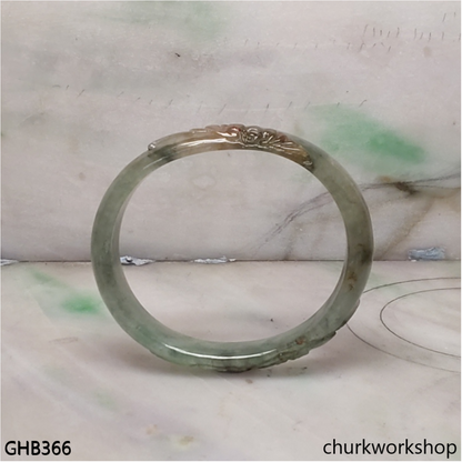 Small carved oval jade bangle