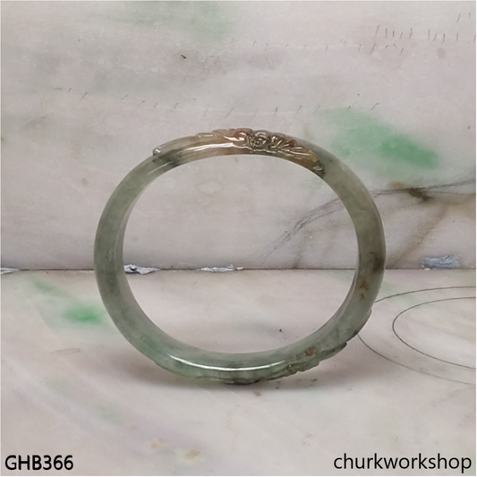 Small carved oval jade bangle